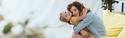 Mother embracing child