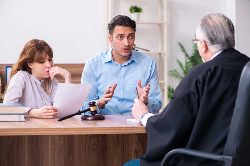 Man and woman in front of a judge