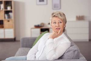 Woman pondering what to ask the divorce attorney